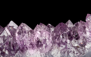 light large amethyst crystals closeup on black