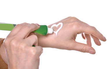 Closeup shot of beautiful female hands  applying moisturiser