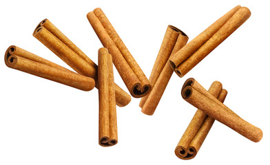 Flying cinnamon sticks, isolated on white background