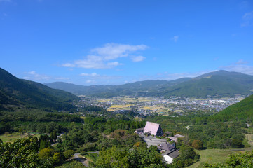 Fototapeta na wymiar Spacious rural scenery on top of the mountain in Yufuin city.Viewpoint of Yufuin in japan.