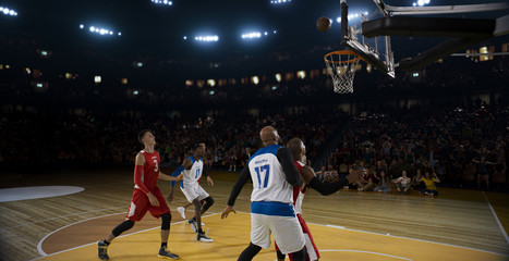 Fototapeta premium Basketball players on big professional arena during the game. Tense moment of the game.