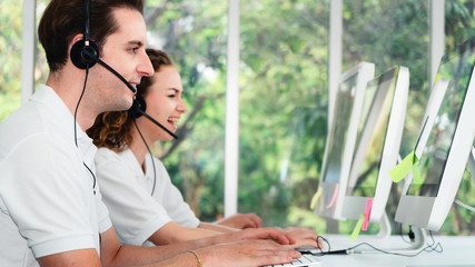 business background of customer service agents on telephone service to customers at helpdesk call...