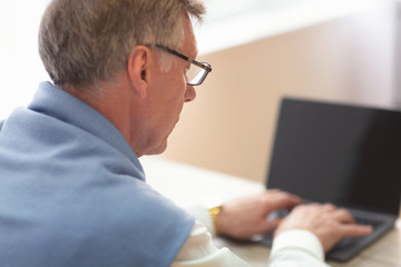 Fototapeta na wymiar Unrecognizable Gentleman Working On Laptop Sitting At Workplace