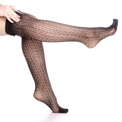 Woman legs in black tights mesh pattern beauty fashion on white background isolation