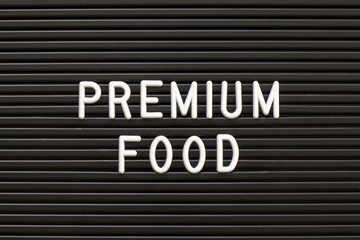 Black color felt letter board with white alphabet in word premium food background