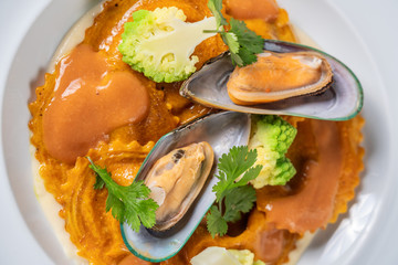 Italian dish with pasta, broccoli and seafood. close-up from above.