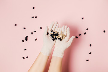 Hand in medical glove with tablet on pink background. Photo on the theme of coronavirus 2019-ncov in China. Flat lay, top view.