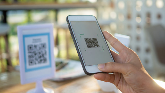 Using mobile phones to pay scanning promotional discounts in restaurants.