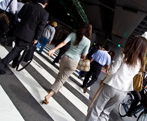 Office workers walking to work in Tokyo Japan