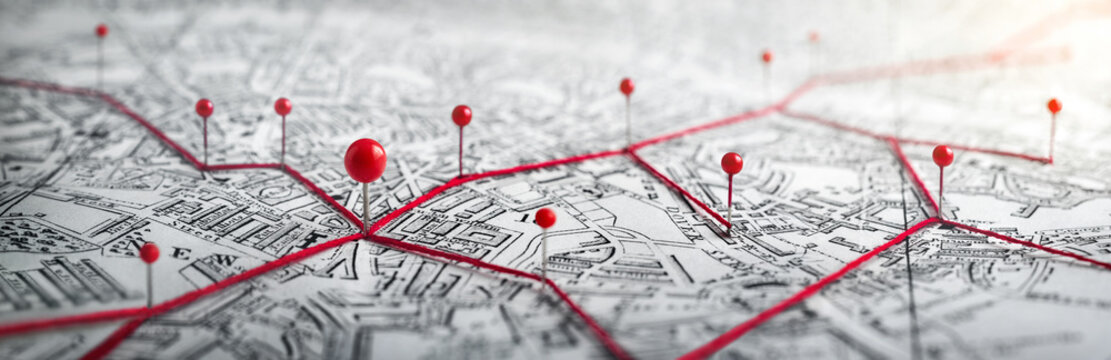 Routes with red pins on a city map. Concept on the adventure, discovery, navigation, communication, logistics, geography, transport and travel topics. © Tryfonov