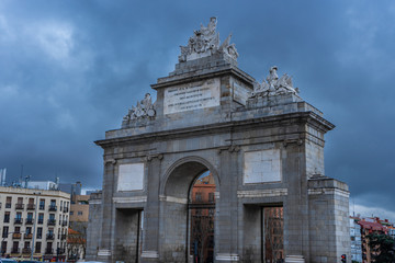 Close up Puerta de Toledo on a cloudy day, in the La Latina neighborhood, triumphal arch dedicated...