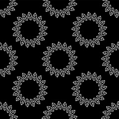 Seamless pattern of hand-drawn leaves. Black and white doodle illustration of leaves.
