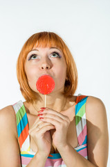 Colorful young woman with lollipop
