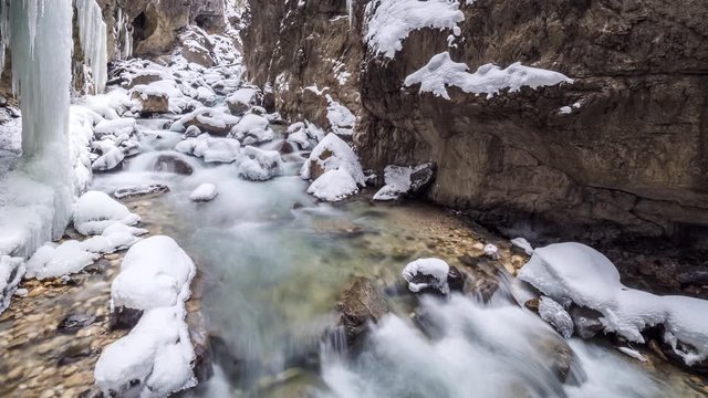 Timelapse of Partnach Gorge mountain stream in winter