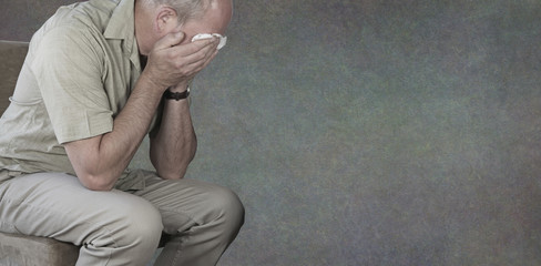 Mental Health Awareness Campaign for Men background banner - crying man with hands holding white...