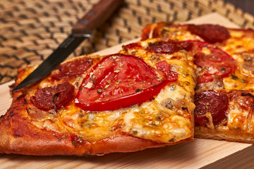 Cheese, tomato and sausage pizza