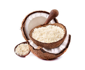 Coconut flakes in wooden bowl isolated on white background. Coconut with coconut flakes closeup.