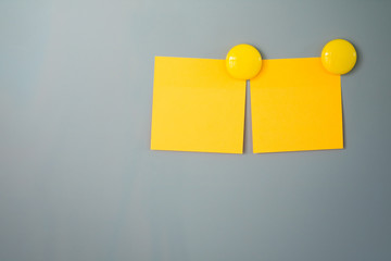 Empty paper stick note on a white background.