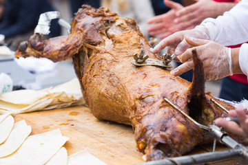 Grilled carcass lamb skewers close-up. Delicious Baked Meat at a food Festival.