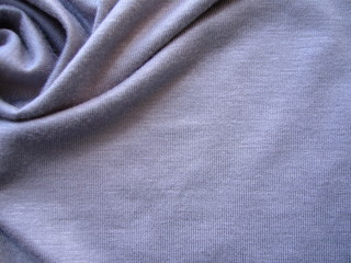 Plakat The texture of the fabric closeup. Mixed gray knit fabric.