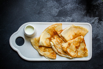 crepes and jam (thin pancakes, healthy breakfast) menu concept. background. top view. copy space