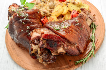 Roaster Pork Knuckle with savoy cabbage and baked potatoes