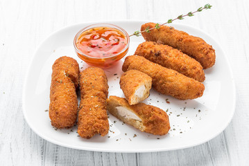 Fried chicken nuggets with ketchup on a plate