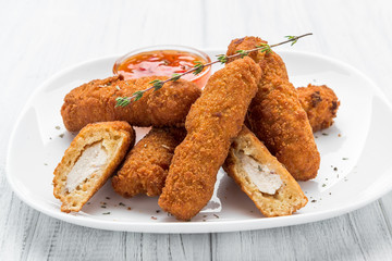 Fried chicken nuggets with ketchup on a plate