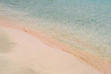 Pink beach with transparent water in Greece. Elafonissi beach, Crete Greece