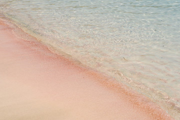 Fototapeta na wymiar Pink beach with transparent water in Greece. Elafonissi beach, Crete Greece