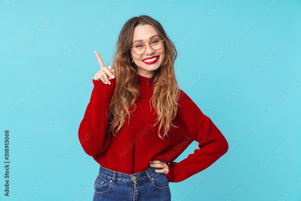 Poster image of funny caucasian woman smiling and pointing finger upward