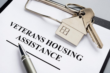 Veterans housing assistance documents and key from home.