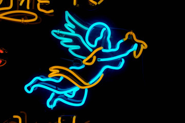 Fototapeta na wymiar blue angel neon sign holy concept marriage
