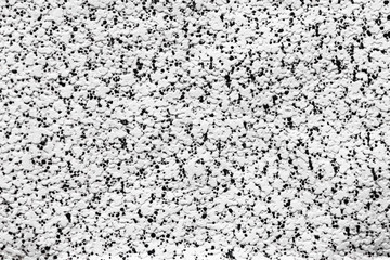 . A spot of different sizes is placed randomly. Useful for printing on fabric, interior decoration, home textile, wrapping paper, white embossed background with randomly scattered black dots, monochro