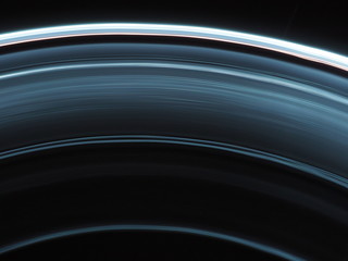 Planetary rings abstract background. Black and blue ellipsis on a deep space dark background