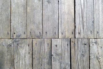 Fototapeta premium Grey color old grungy wooden planks background.