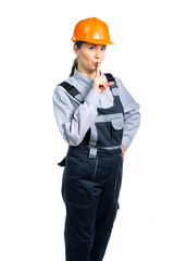 The girl in construction clothes shows a gesture with his hands. Everyone is quiet.