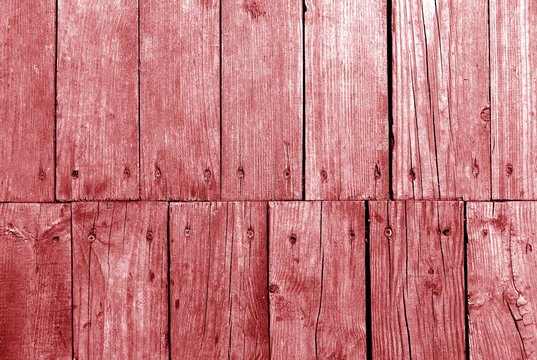 Old grungy wooden planks background in red color.