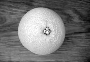 Mandarin on wooden board in black and white.