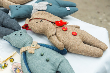 Closeup of handmade toys showcased on a stall. Original items sold by local craftsmen and designers...