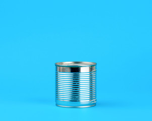 hard iron can for food preservation on a blue background