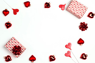 Frame of gift boxes and hearts on white background. Valentine's day concept.