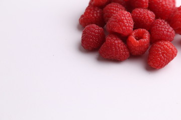 delicious raspberries in colorful background