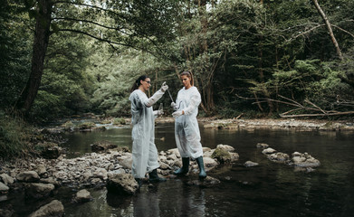 Team of scientists and biologists researching possibilities for bacteria and virus spreading through natural flowing supplies of drinking water.