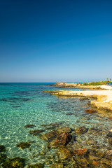 The most famous beach of Cyprus with crystal clear water. Nissi Beach.