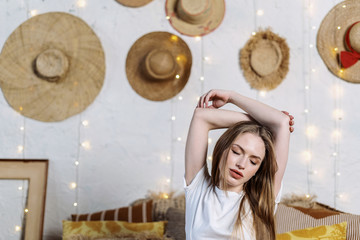 Young adult woman spending weekend day at home