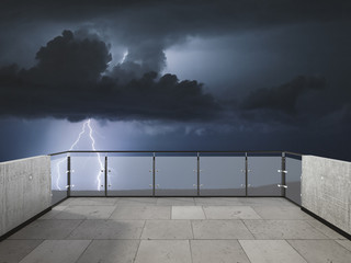 Thunderstorm on the balcony. Balcony view of  sky with thunder. Landscape. Night. Terrace with a beautiful view of storm. Background with beautiful landscape. Storm in the night.