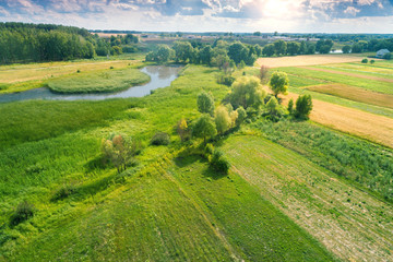 Aerial view of countryside and brook on a spring sunny day. Beautiful nature landscape in spring