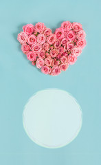Valentine's day banner.Holiday card with a heart of pink roses on a blue background.Congratulation.Creative.diy.Women's day.Mother's day.love.postcard.Banner.Vertically.