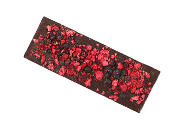 Whole bar of vegan black chocolate with included pieces of dried berries